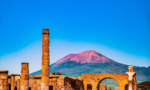 Front view of pompeii ruins in Italy.Mount Vesuvius shown in the backgraound.